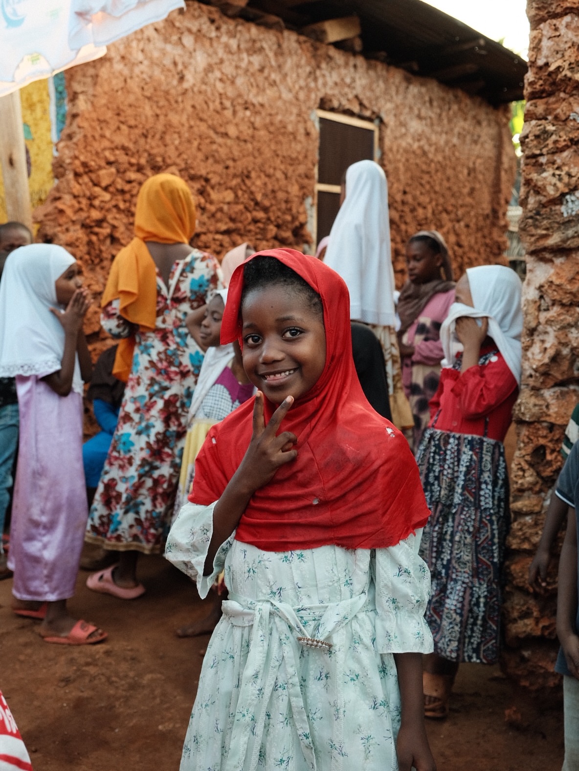 Local families gathered in a Zanzibar village setting