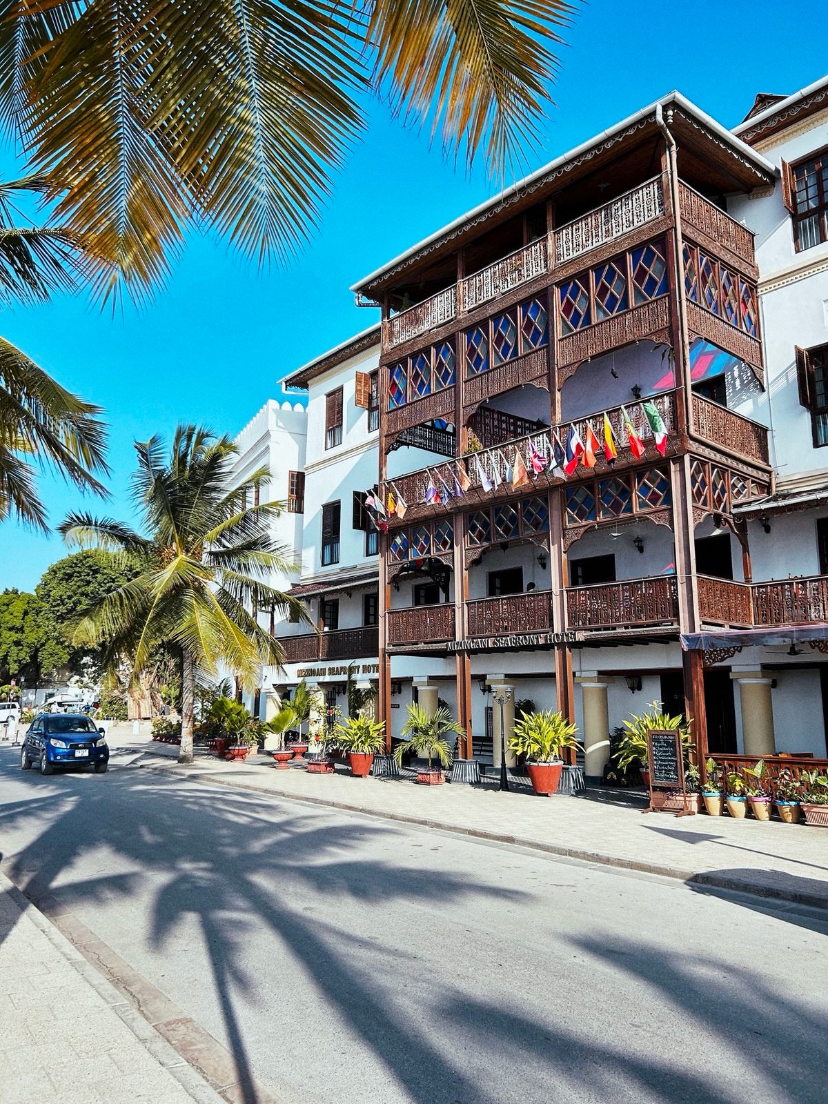 A Zanzibar street lined with palms and local architecture